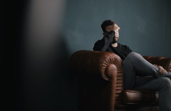 Person feeling emotionally exhausted